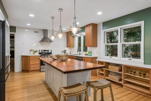 Updated open kitchen includes newer appliances, including 2 ovens, and large center island