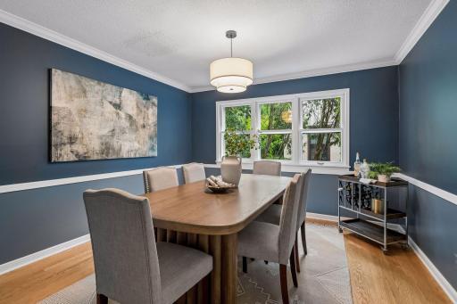 Formal dining room located between living room and kitchen