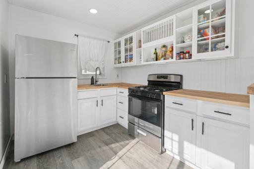 Stainless Steel Appliances with White Cabinets