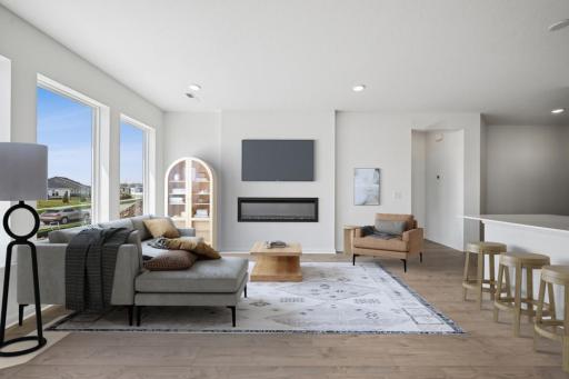 Virtually staged family room. Photo of actual home.