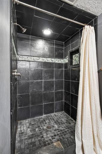 This bathroom features a tiled shower