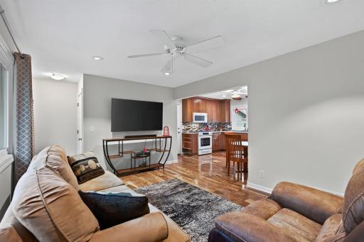 The great living room space opens up to a fully remodeled kitchen