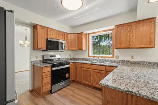 Total remodeled kitchen, brand new cabinet, flooring, appliances light fixtures, painting.