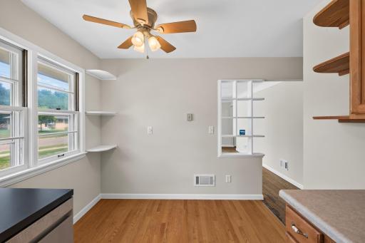Eat in kitchen area that looks into the living room and into the kitchen.