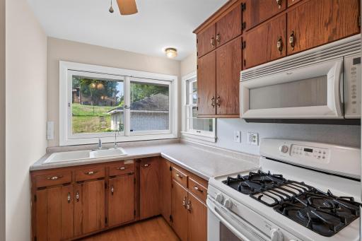 Lots of windows in the kitchen with a corner sink that overlooks the backyard.