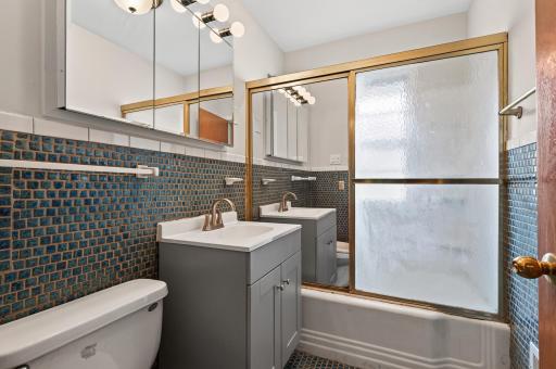 This is the main floor full bathroom with new LVP flooring.