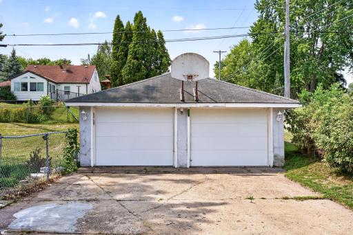 Detached garage and kids basketball court.
