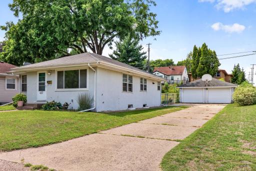 3 beds, 1 bath, 2 car garage with a concrete driveway.