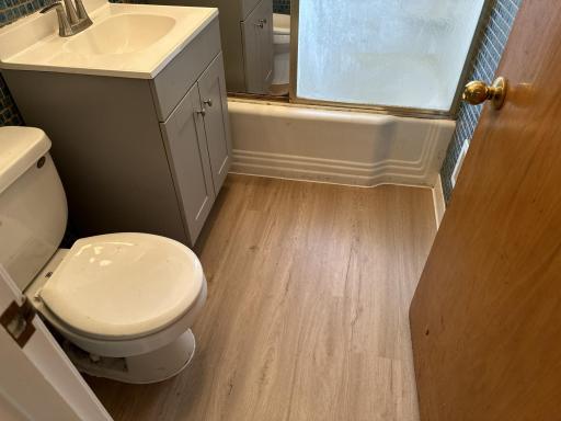 Main floor full bathroom with new flooring.