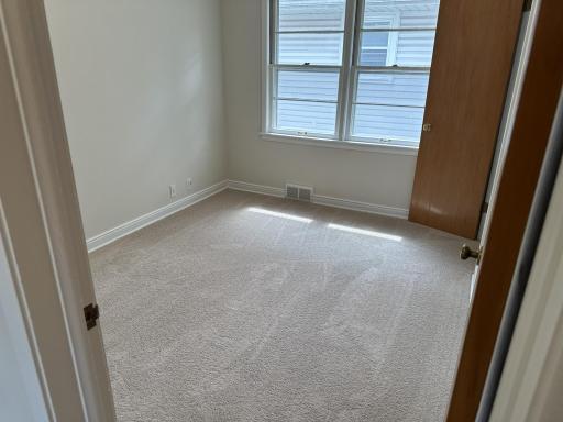 2 of 3 main floor bedrooms with new carpet and paint.
