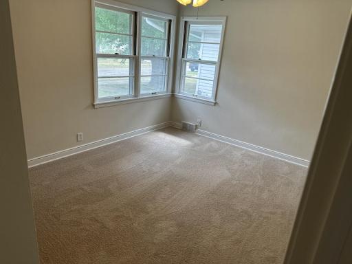 3 of 3 main floor bedrooms with new carpet and overhead ceiling fans and fresh paint.
