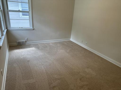 3 of 3 main floor bedrooms with new carpeting and overhead ceiling fans.