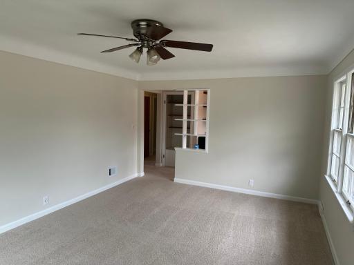 Upper level living room looking into the dining room area.