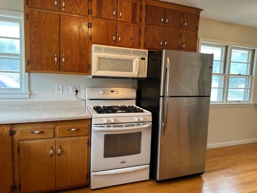Gas stove, Microwave has a crack in the door but works.