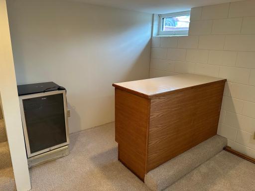 Lower level built in Bar area with a mini fridge.