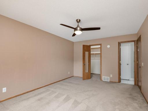 The primary bedroom offers a huge walk in closet & access to the walk-through main level full bath.