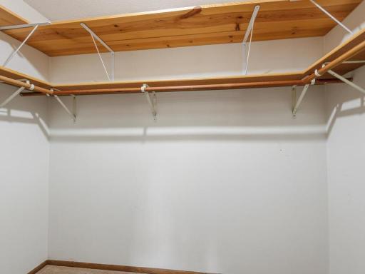 Awesome storage in the primary walk-in closet!
