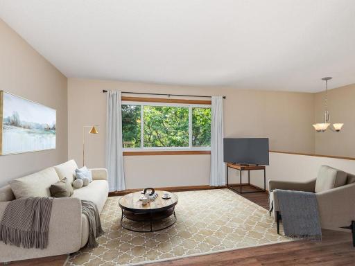 Virtually Staged...All rooms are filled with natural light from large, updated windows.
