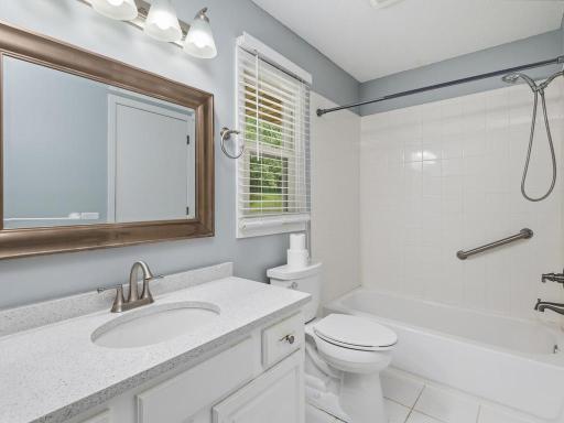 The full main level bath is updated, clean & bright with a window for natural light & ventilation.