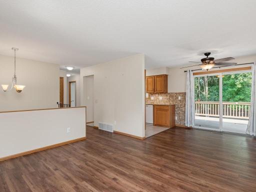 The living room flows into the dining area that overlooks the beautiful park-like backyard.