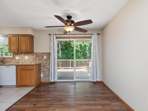 The dining room easily accommodates a 6 person table & chairs & the new patio doors lead to a fantastic deck with views of the private backyard.