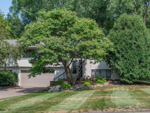 Mature trees & landscaping surround the home providing privacy & curb appeal.