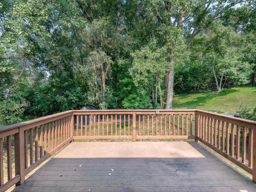 Partially maintenance free deck overlooks a beautiful fenced backyard. A wonderful spot to enjoy the nature that surrounds you here!