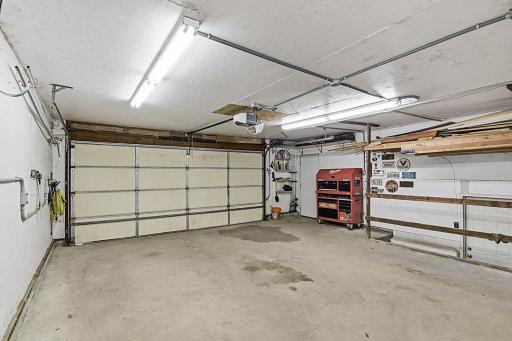 Attached Garage interior with shop lights