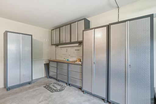 Garage cabinets can stay, fantastic storage. There is a remote controlled lift to the garage attic storage space