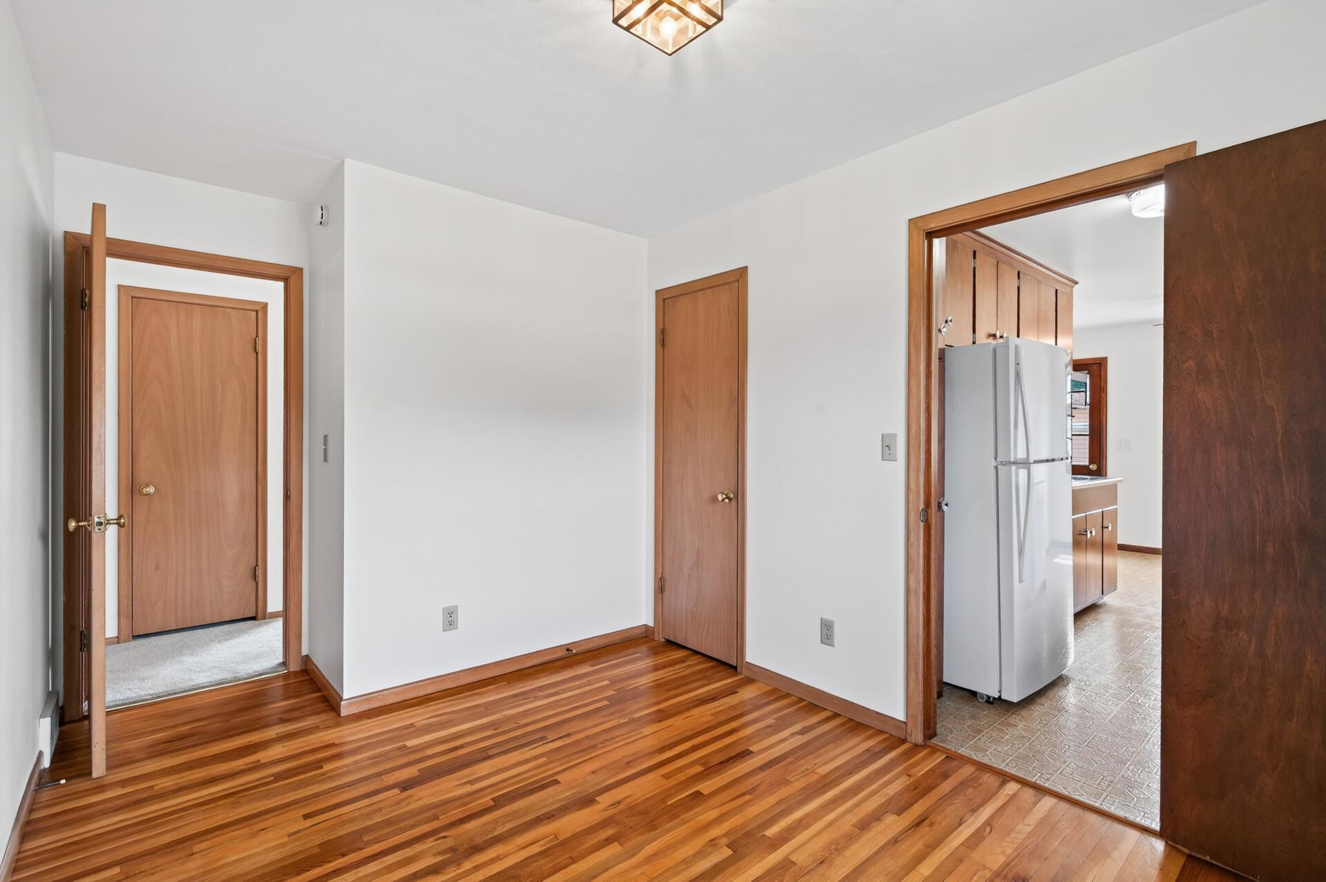 This room could be a third bedroom or sometimes used as a more formal dining room. Beautiful hardwood floors