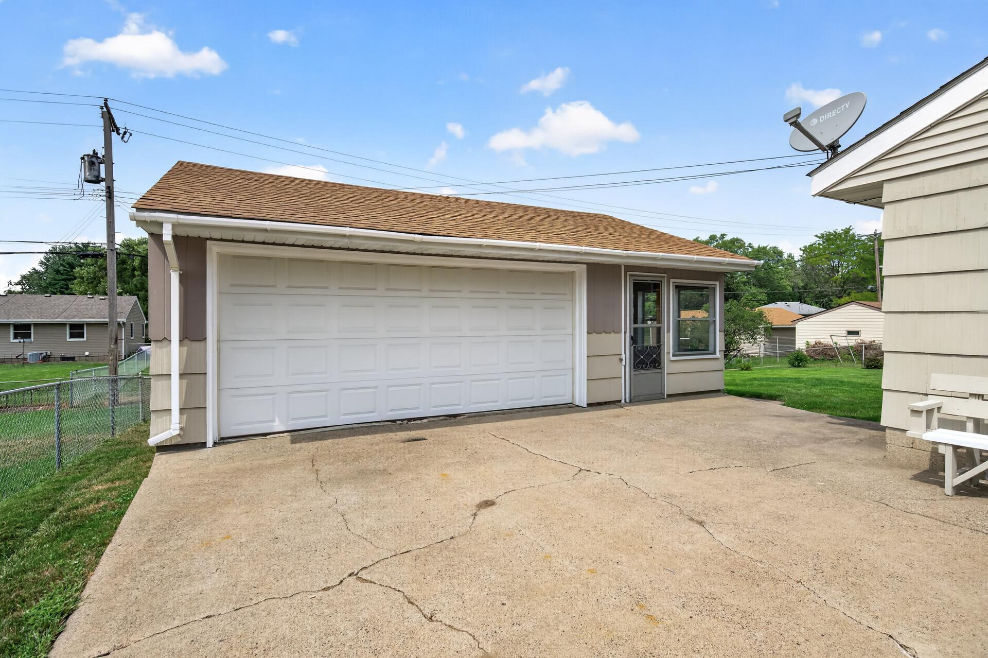 The attached screen porch is so charming with its cedar walls and ceiling. The yard is fully fenced and the wooden fence and gate from the garage to the house (to complete it) is in the shed.