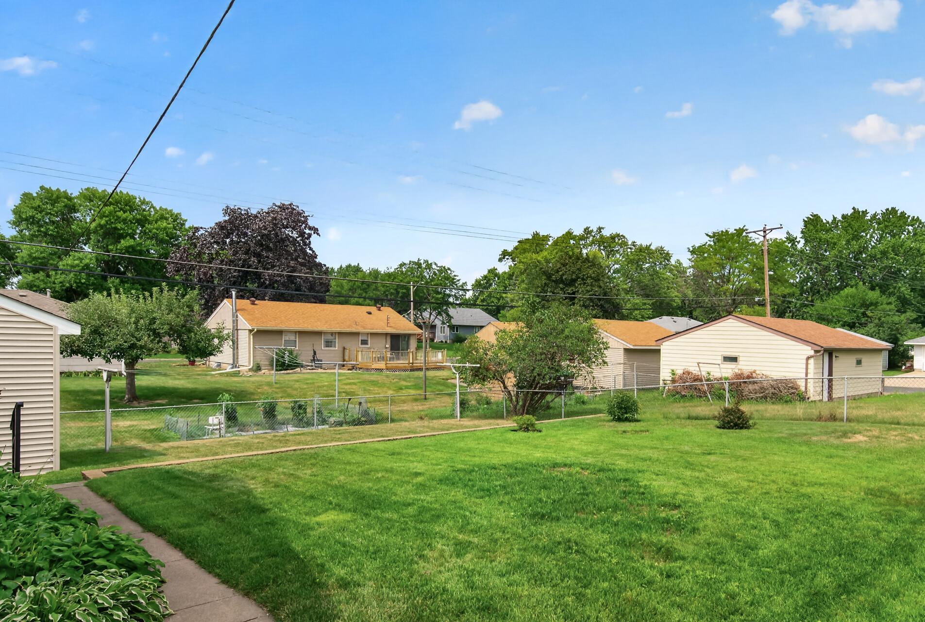 Huge fenced back yard. Notice the sidewalk down to the shed.