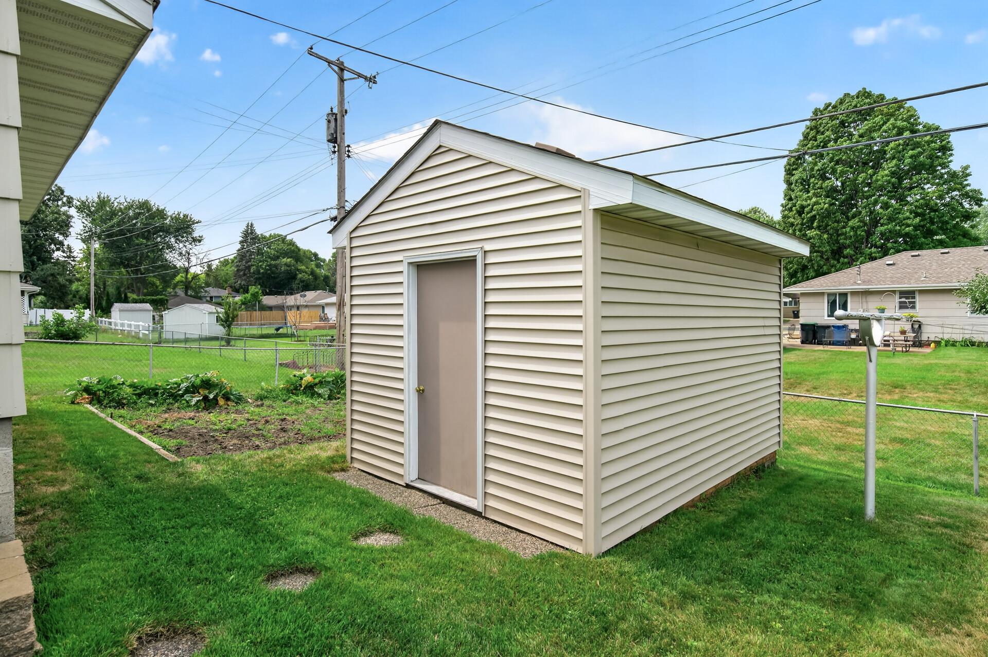 Storage shed for all the extras. Note the gardening space and clothes line!
