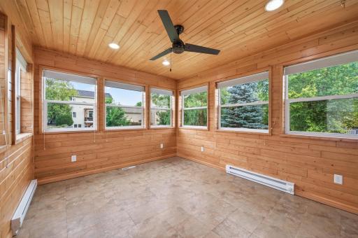 Easy vinyl floors and windows surround with recess lighting and ceiling fan