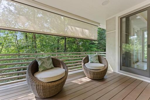 Covered main floor balcony/deck with power sun shade