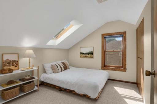 The upper level includes an additional bedroom
