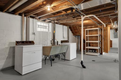 Laundry area in the unfinished lower level
