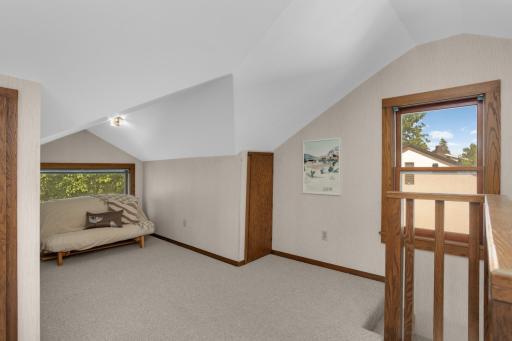 The upper level includes a spacious loft area that provides lots of flexibility and room for a home office or sitting area