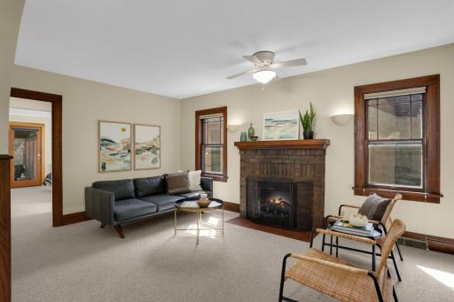 A gorgeous brick fireplace is the centerpiece of the living room