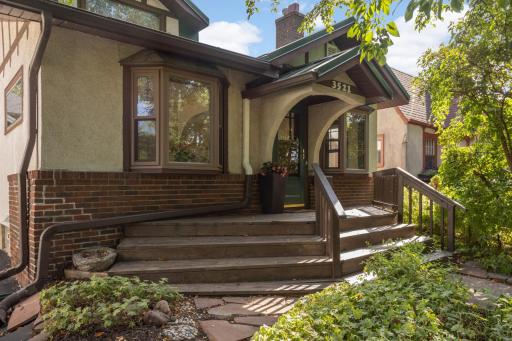 Beautiful architectural details, including a front facade with classic bungalow features, 2 bay windows, and a charming front door canopy
