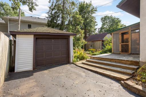 This home has its own private driveway to the garage and a deck and screened porch in the backyard