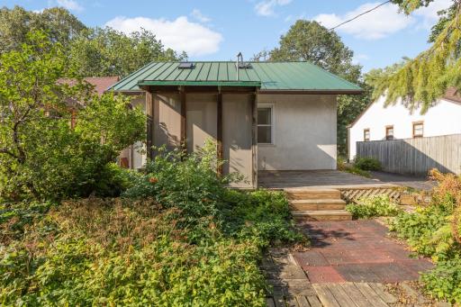 The screened porch provides a private oasis in the lushly landscaped backyard