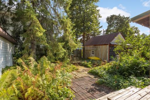 Beautiful, lush landscaping in the backyard makes it feel like you are surrounded by nature
