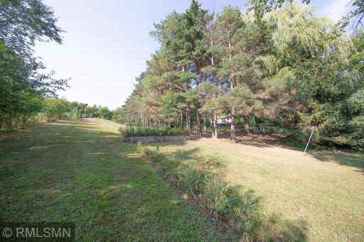 Tucked into the majestic legacy aged woods. This type of setting is getting more rare by the year and it could be yours..