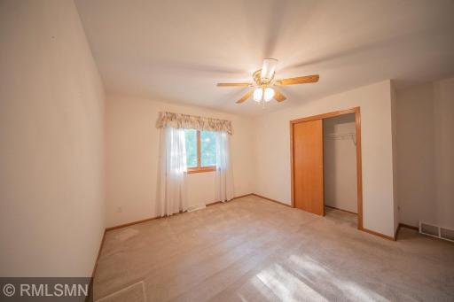 Bedroom 2 enjoys natures views and a spacious closet..