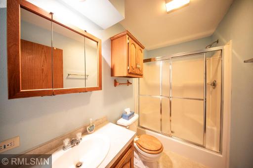 Second bath on main level is amply sized with tub and shower.