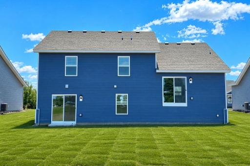 Walkout lower level! Photo is of actual home. Colors and options may vary. Ask Sales Agent for details. AI-generated landscaping for visualization. Actual yard condition may differ.