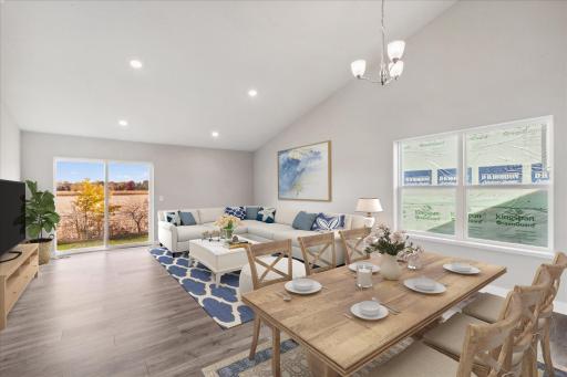 Vaulted ceiling and windows throughout means plenty of natural light. Photo is of similar staged home. Colors and options may vary. Ask Sales Agent for details.