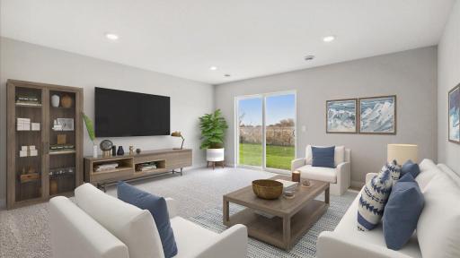 Migrate to the lower-level living room. Photo is of similar staged home. Colors and options may vary. Ask Sales Agent for details.