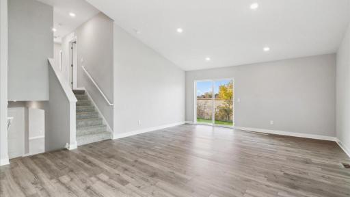 The kitchen area opens up to the main living area. Photo is of similar home. Colors and options may vary. Ask Sales Agent for details.